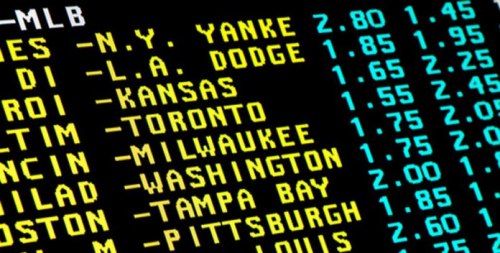 An electronic tote board with odds for baseball games.