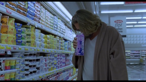 still from Big Lebowski of The Dude sniffing milk carton