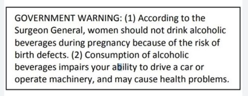 black and white 'Government Warning' label stating risks associated with alcohol consumption during pregnancy and impaired ability to drive or operate machinery, and health problems.